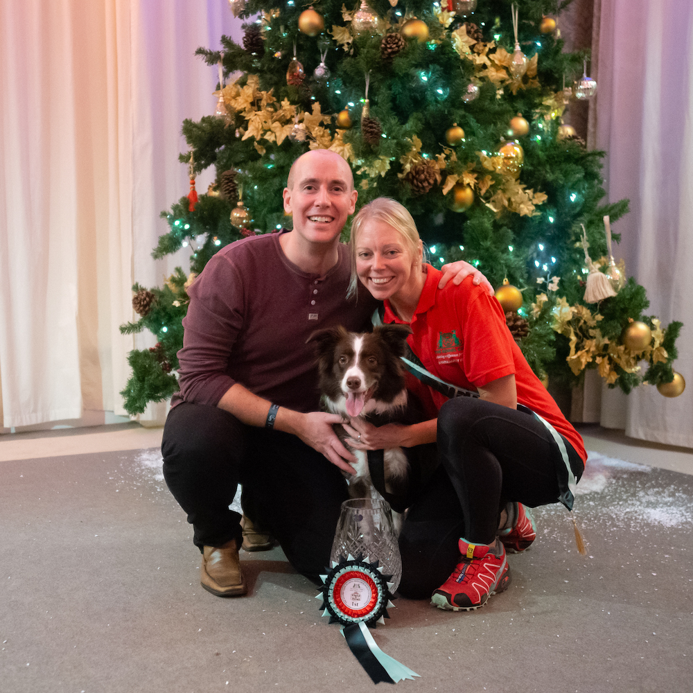 Natasha, Matt & Pebbles celebrating the Kennel Club Olympia Agility Dog of the Year win in 2018 - Photo by Yulia